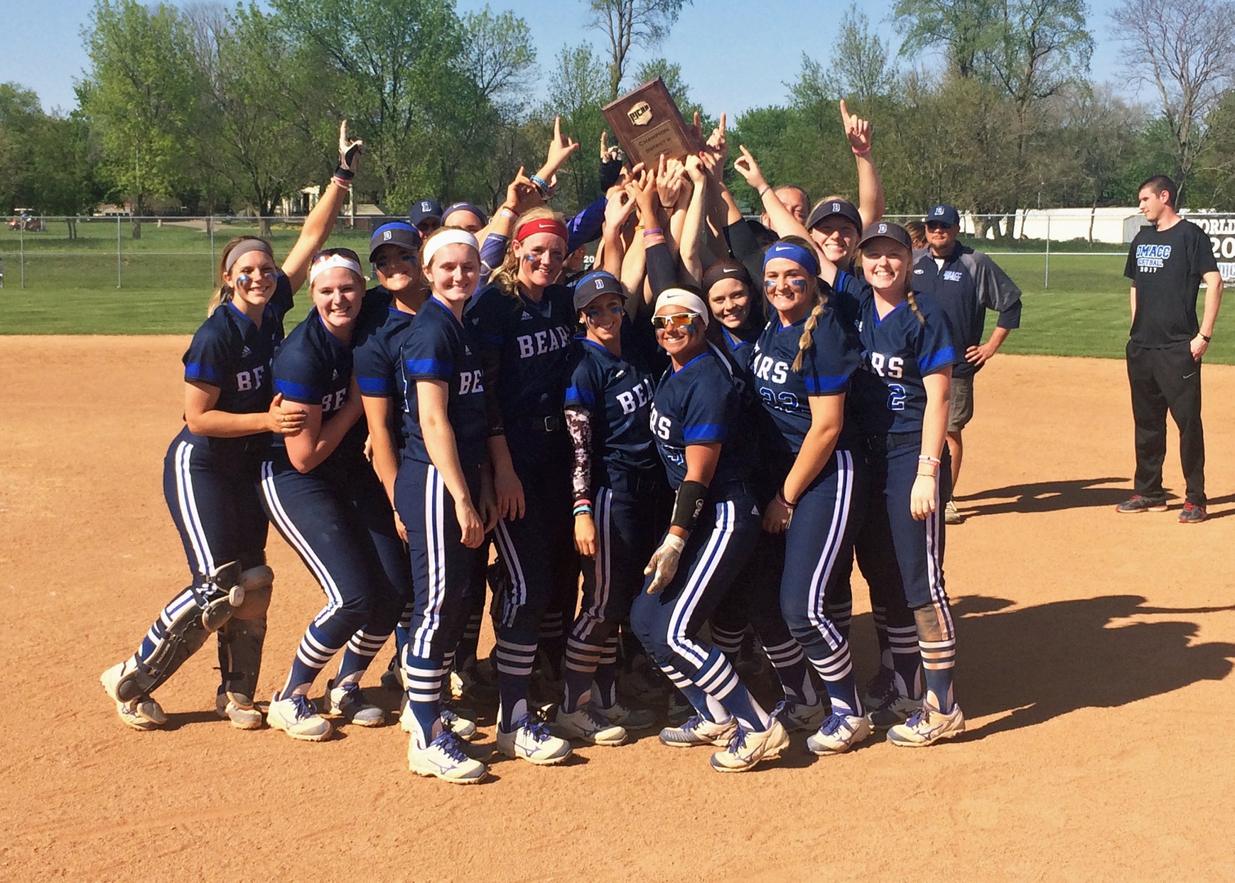 Bears hoist the District Trophy following clinching its fifth World Series berth in six seasons.